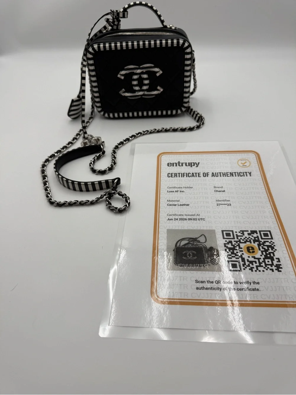 Chanel black and white filigree vanity bag in caviar leather
